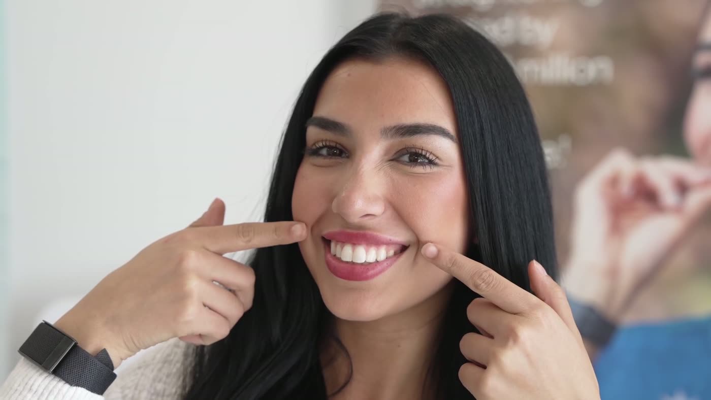 Patient smiling after cosmetic dental treatment